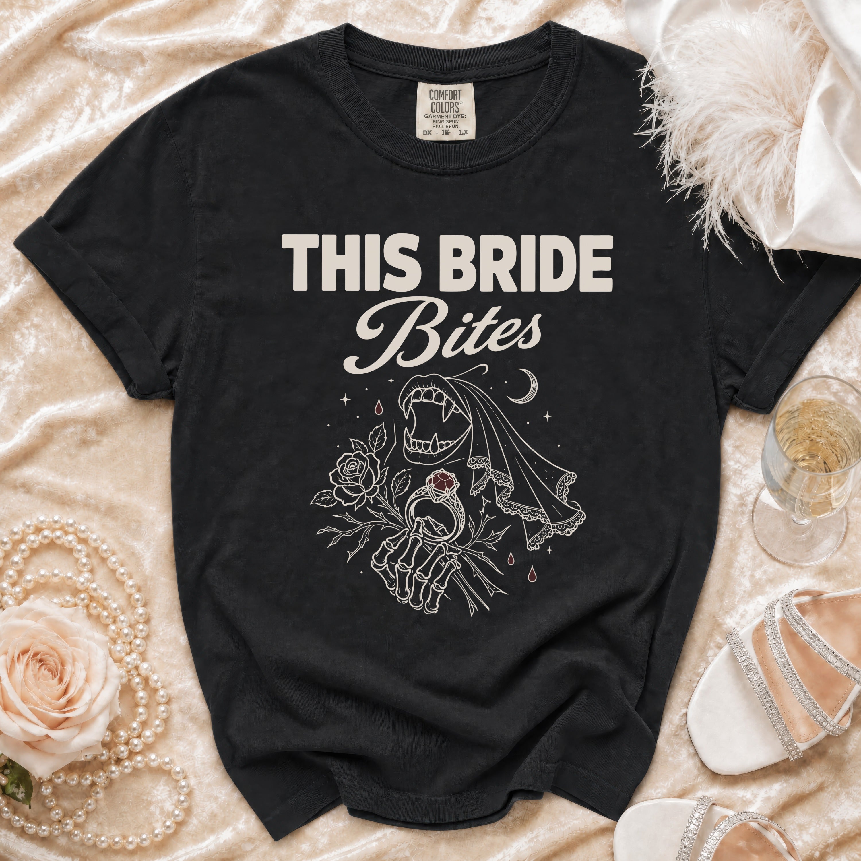 Black t-shirt with "THIS BRIDE Bites" text and vampire wedding graphic.