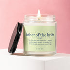 Candle with label "father of the bride" and definition on pink background.