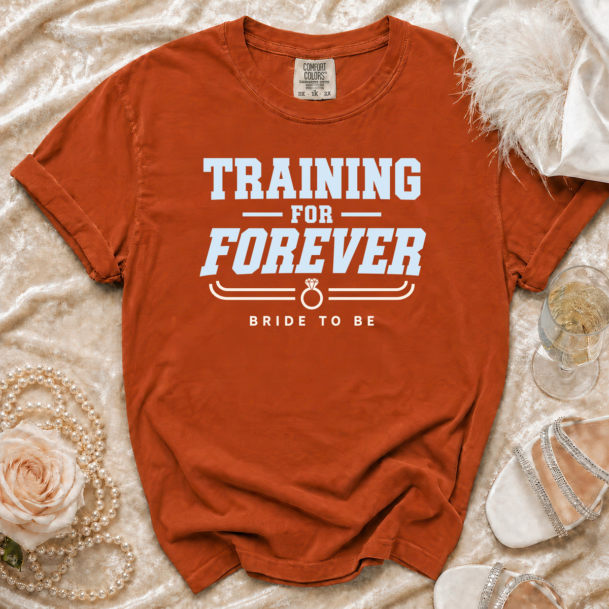 Orange t-shirt with "TRAINING FOR FOREVER BRIDE TO BE" text.