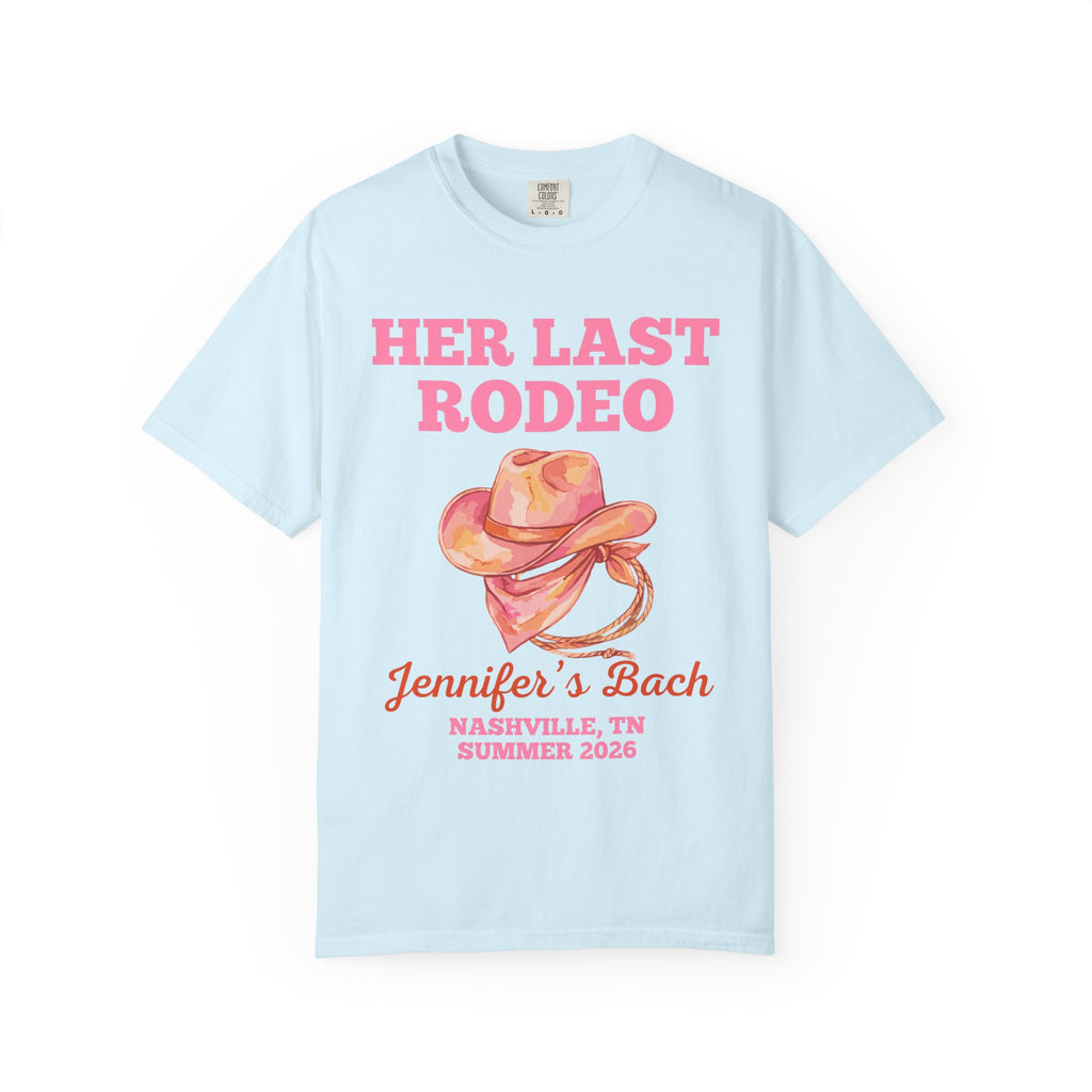 Light blue t-shirt with pink text "Her Last Rodeo" and a cowboy hat.