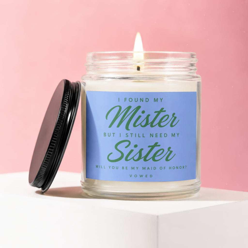 Candle with blue label asking "Will you be my maid of honor?".