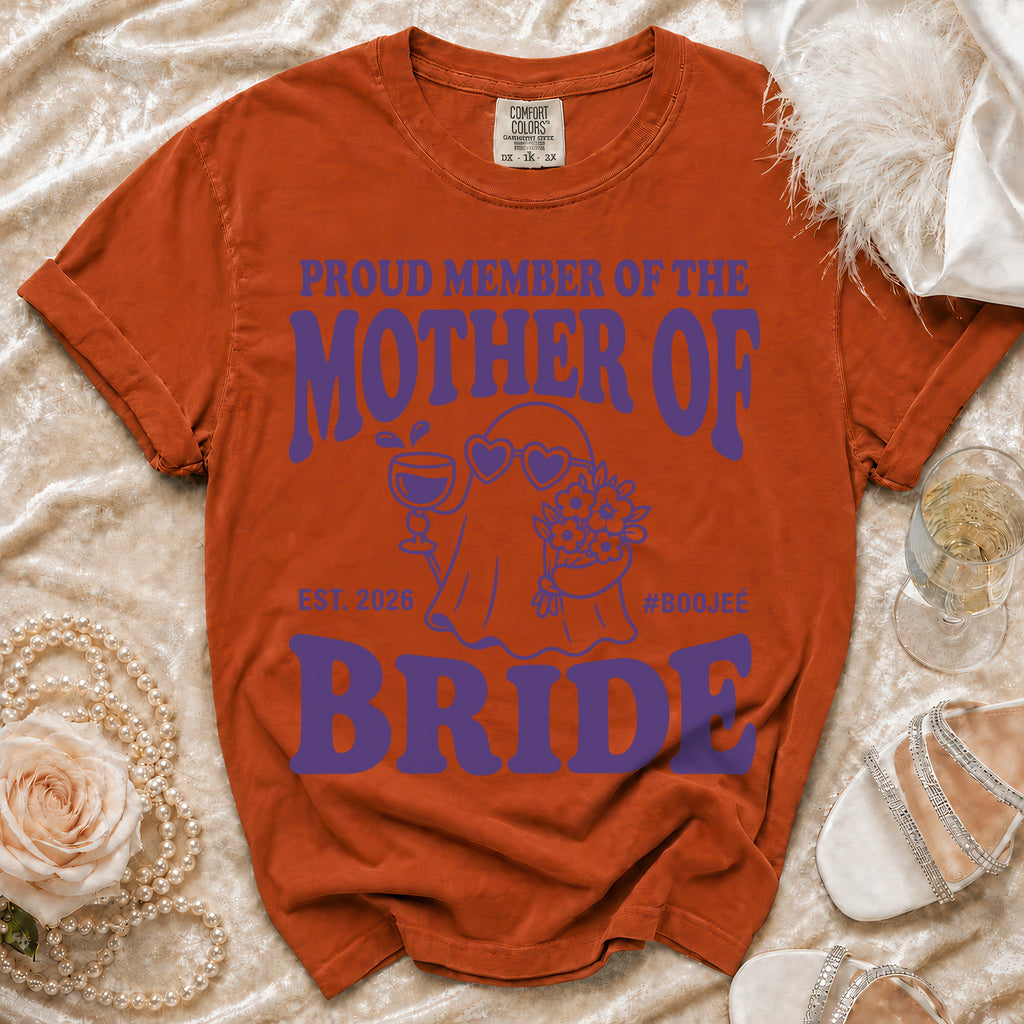 Orange t-shirt with purple text "Proud Member of the Mother of the Bride" and graphics.