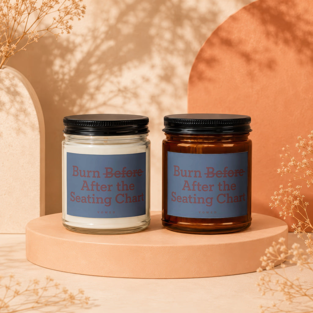 Two candles with blue labels reading "Burn Before After the Seating Chart".