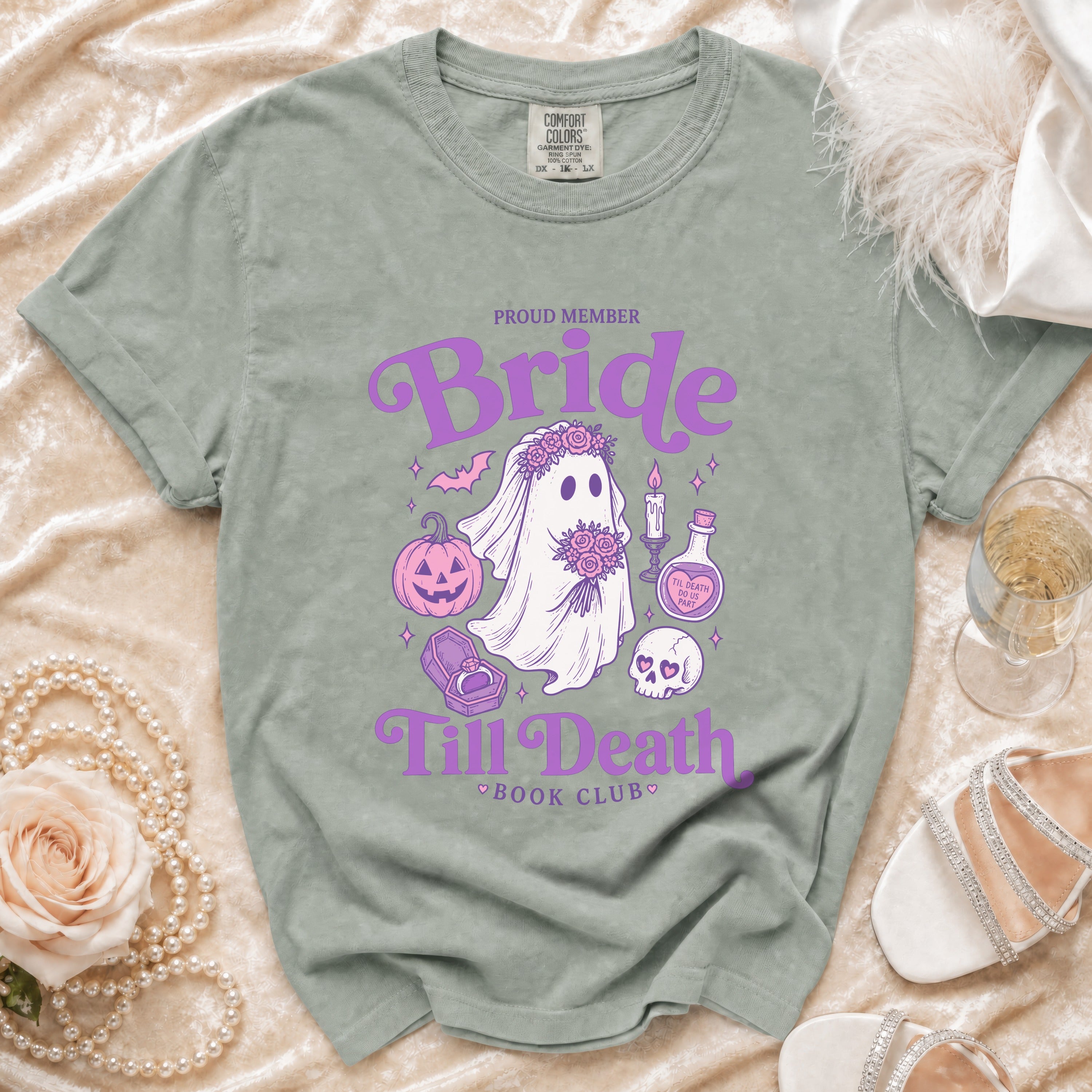 Bride and "Till Death Book Club" graphic on a sage green t-shirt.