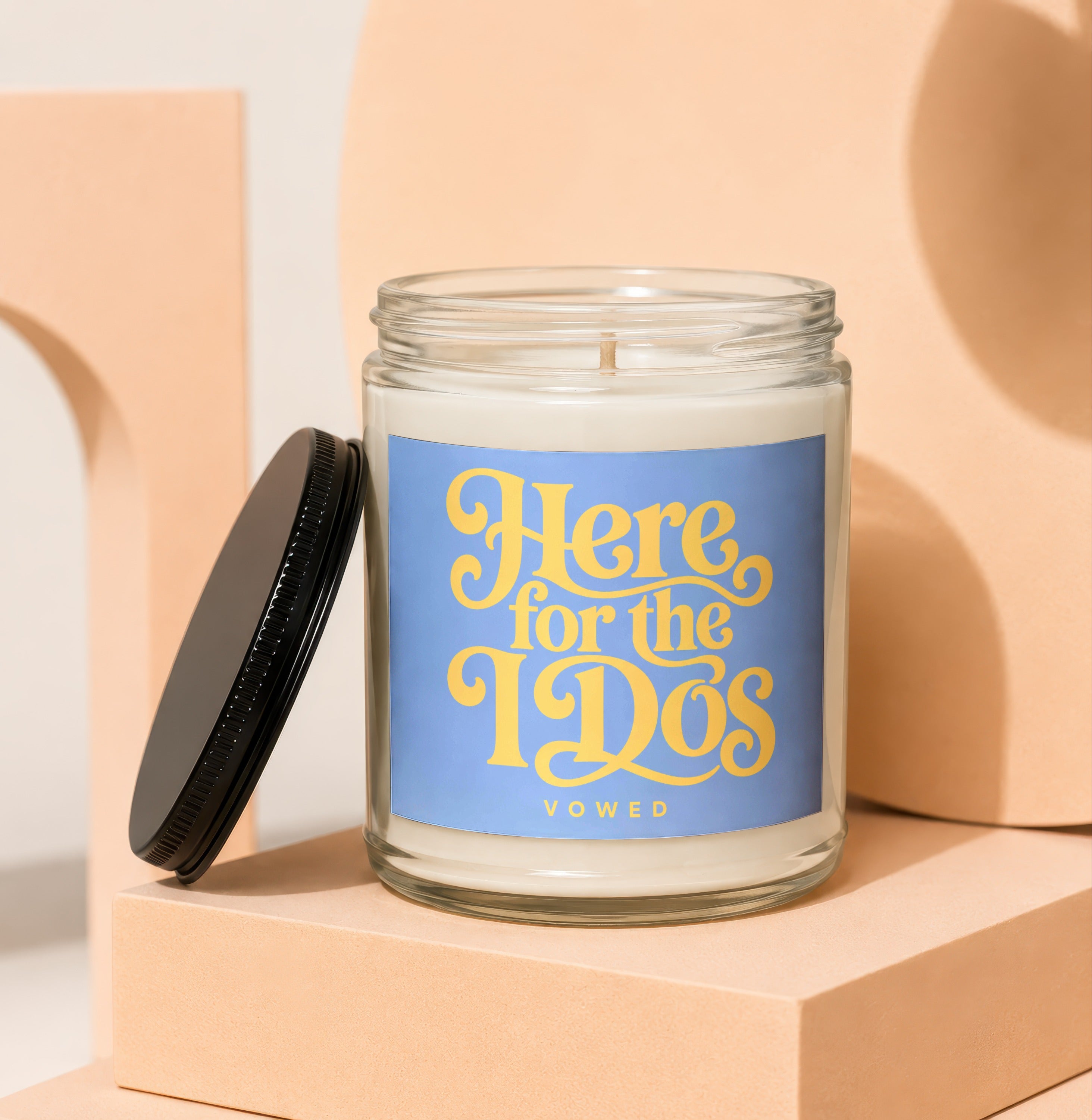 Candle with "Here for the IDs" text on a blue label.