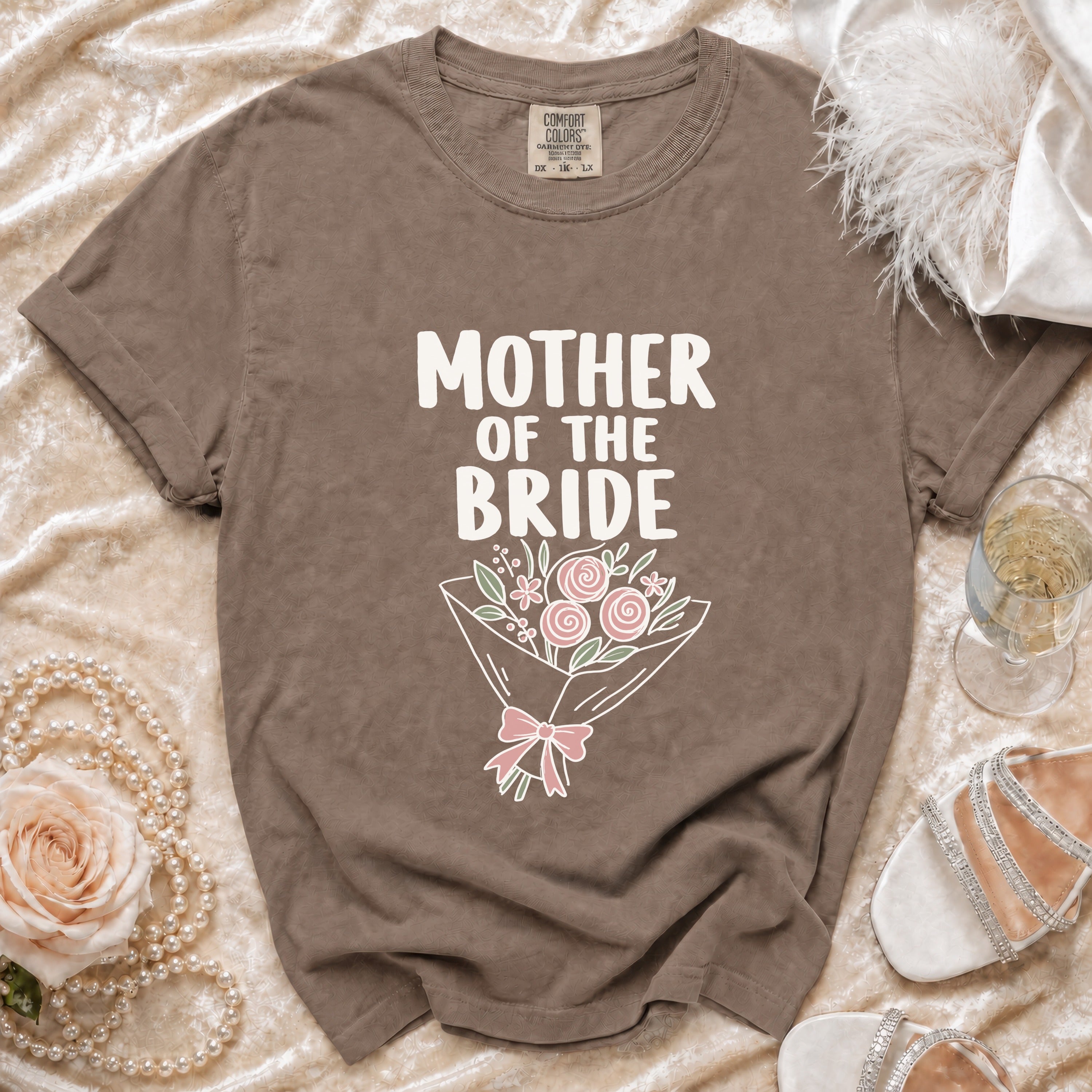 Brown t-shirt with "MOTHER OF THE BRIDE" text and floral bouquet graphic.