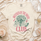 Cream t-shirt with "Mother of the Bride Club" text and bridal graphics.
