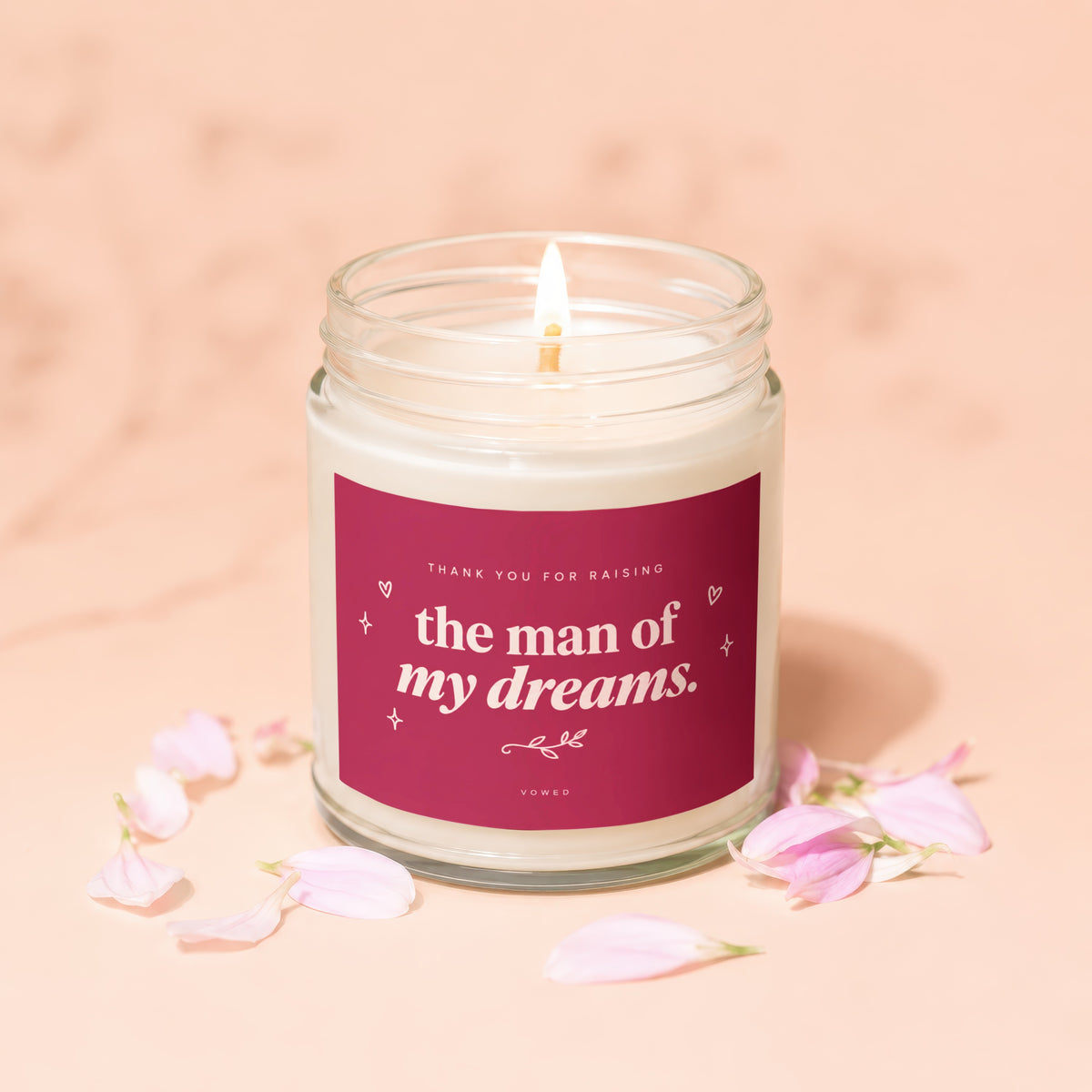 Lit candle with pink petals and text "Thank you for raising the man of my dreams."