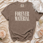 Brown t-shirt with "FOREVER MATERIAL" in white serif font, Comfort Colors tag.