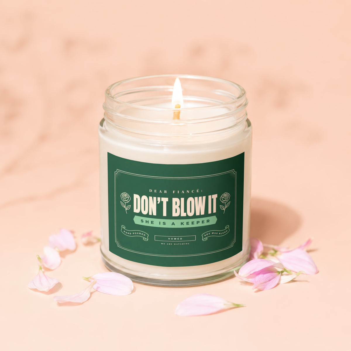 Candle with "Don't Blow It, She is a Keeper" text on label.