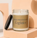 Glass candle with metallic label reading "High Priestess of Logistics".
