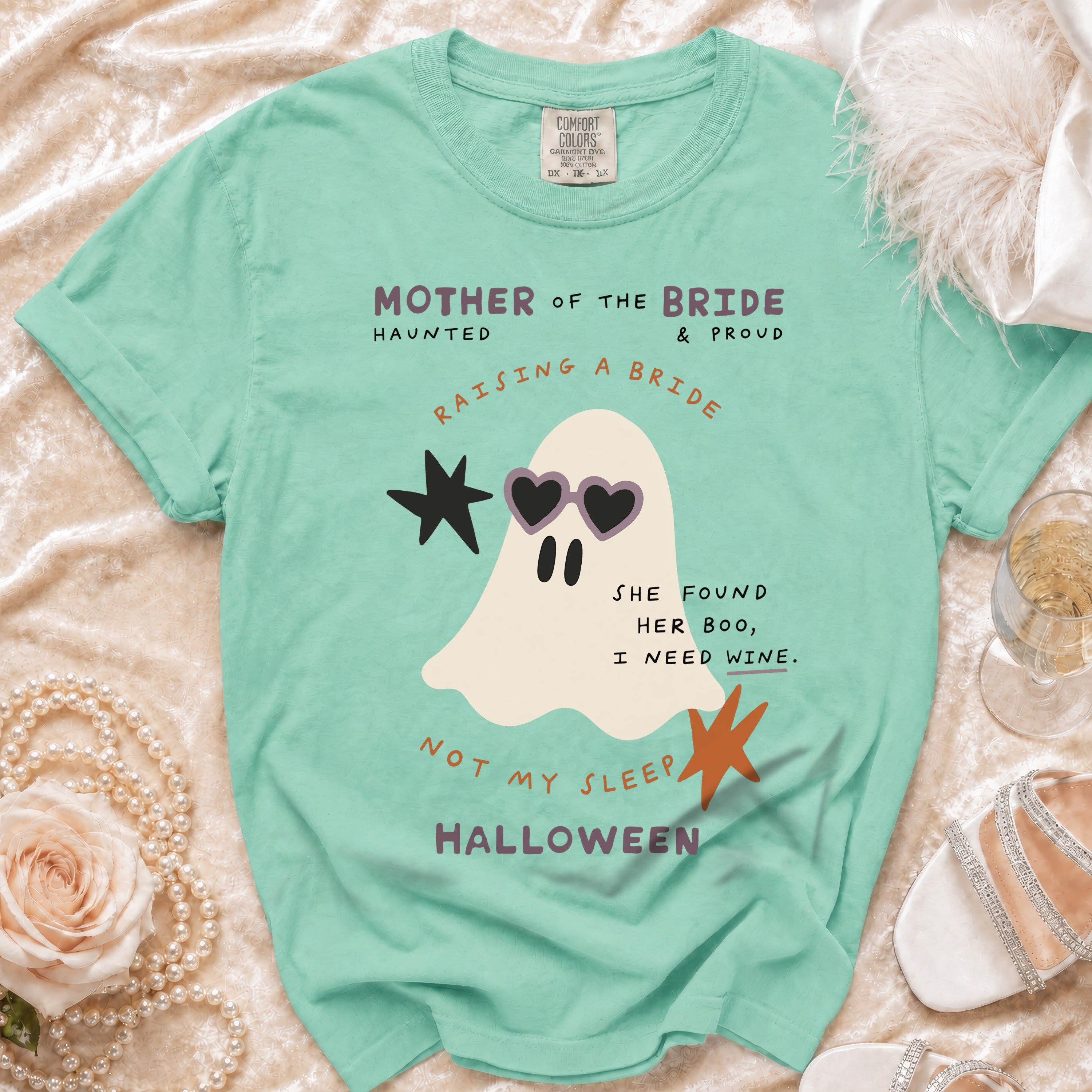 Mint t-shirt with ghost graphic reading "Mother of the Bride," "Raising a Bride," and Halloween theme.