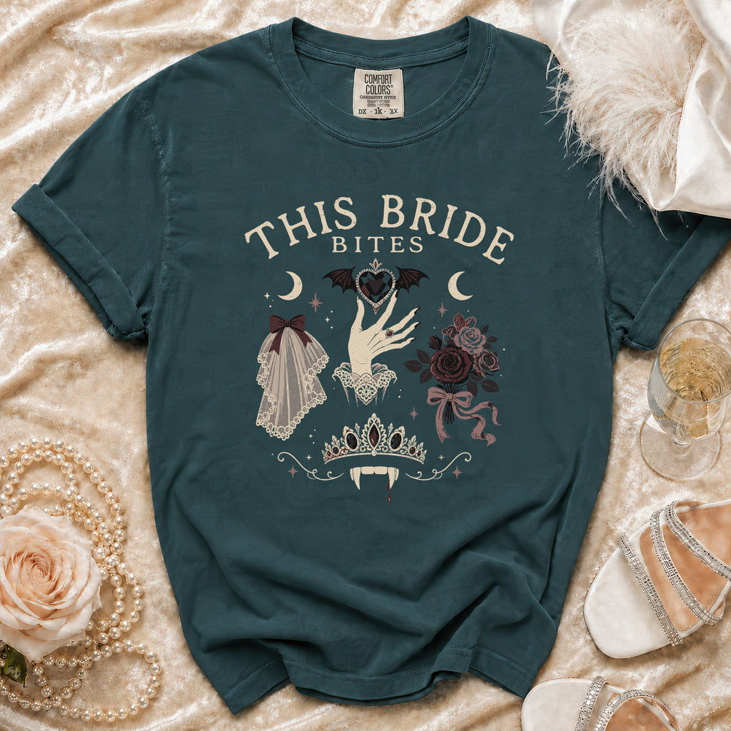 Teal t-shirt with "This Bride Bites" text and vampire-themed bridal icons.