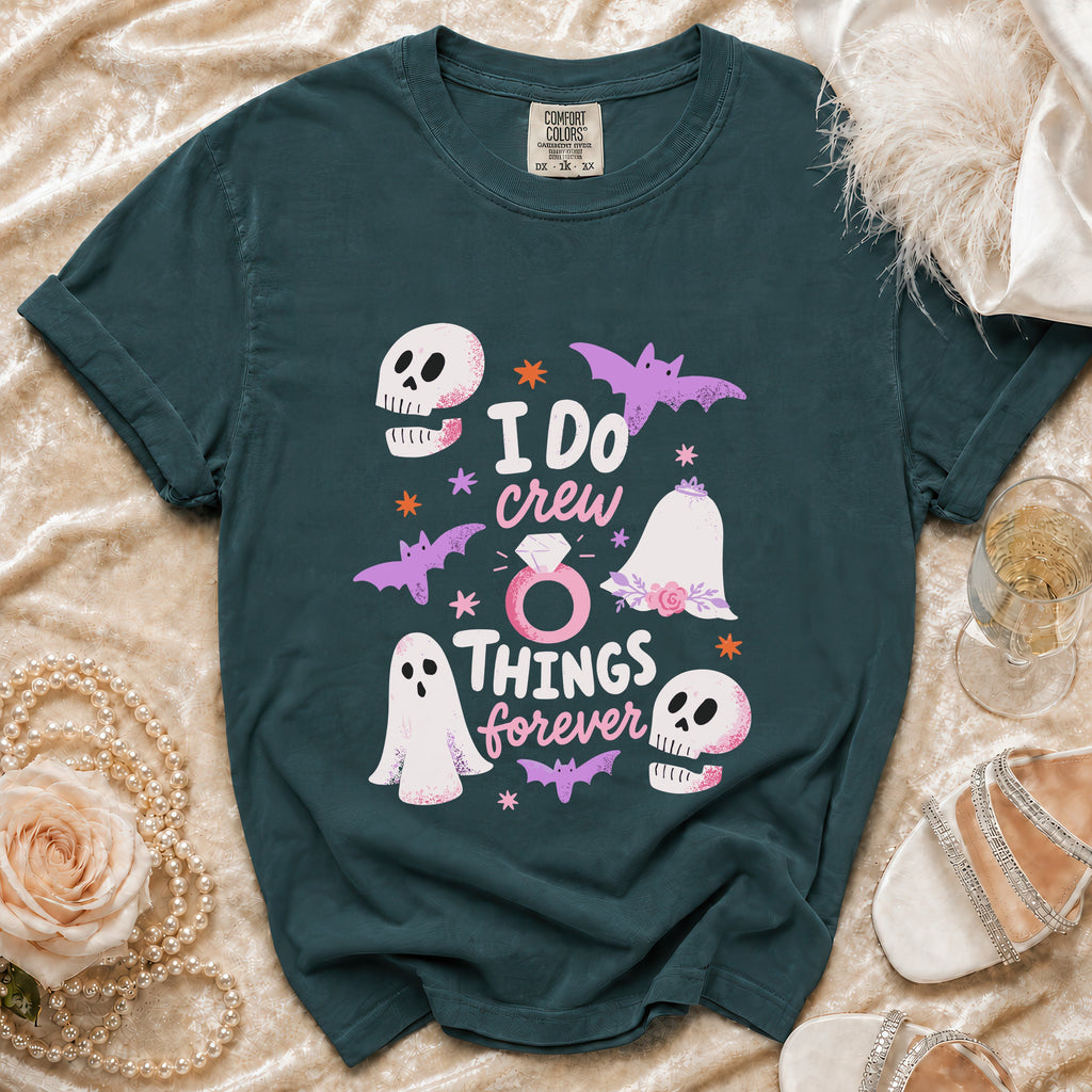 Teal t-shirt with "I DO crew THINGS forever" text and Halloween graphics.
