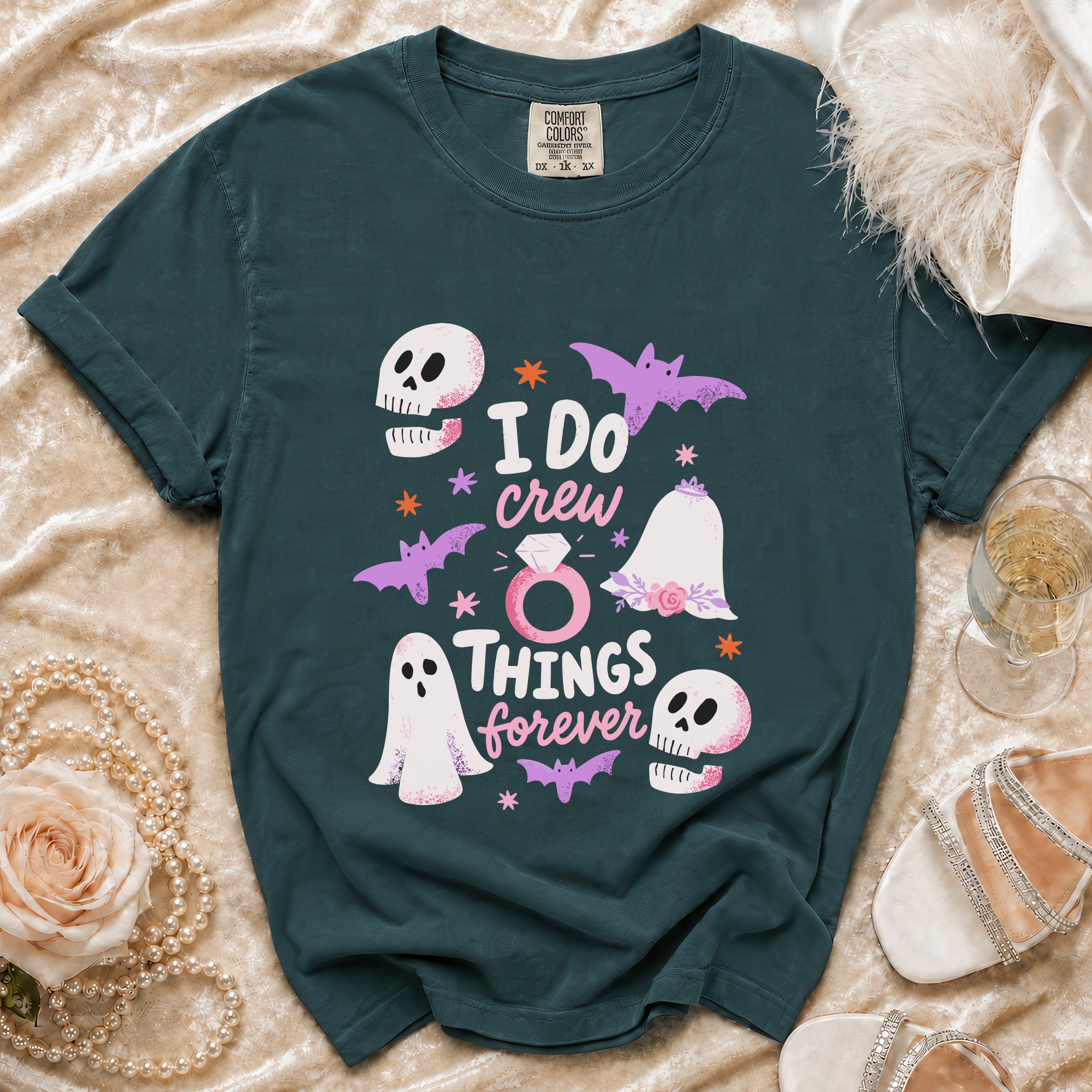 Teal t-shirt with "I DO crew THINGS forever" text and Halloween graphics.