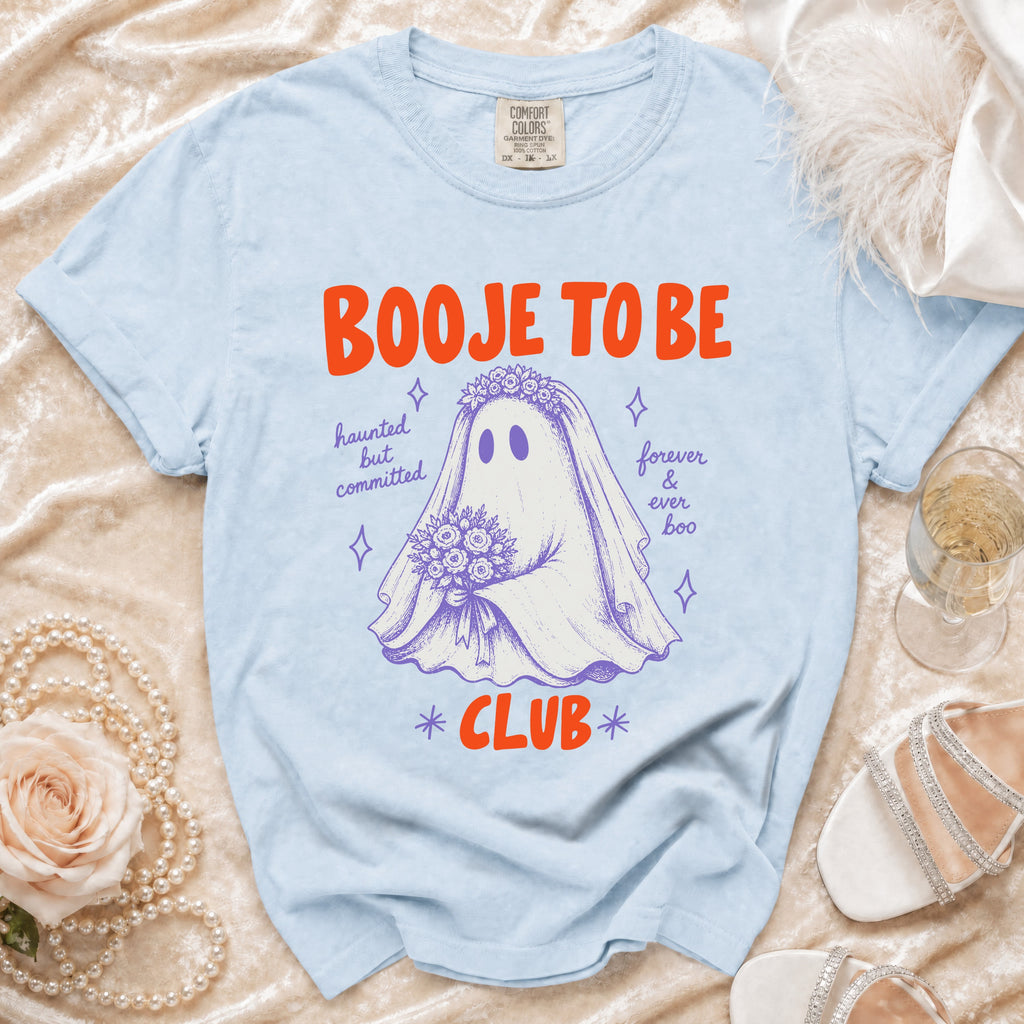 Light blue t-shirt with "Booje to be Club" text and a ghost bride graphic.