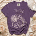 Purple t-shirt with "Mother of the Bride" graphic, tote bag, and coffee cup.