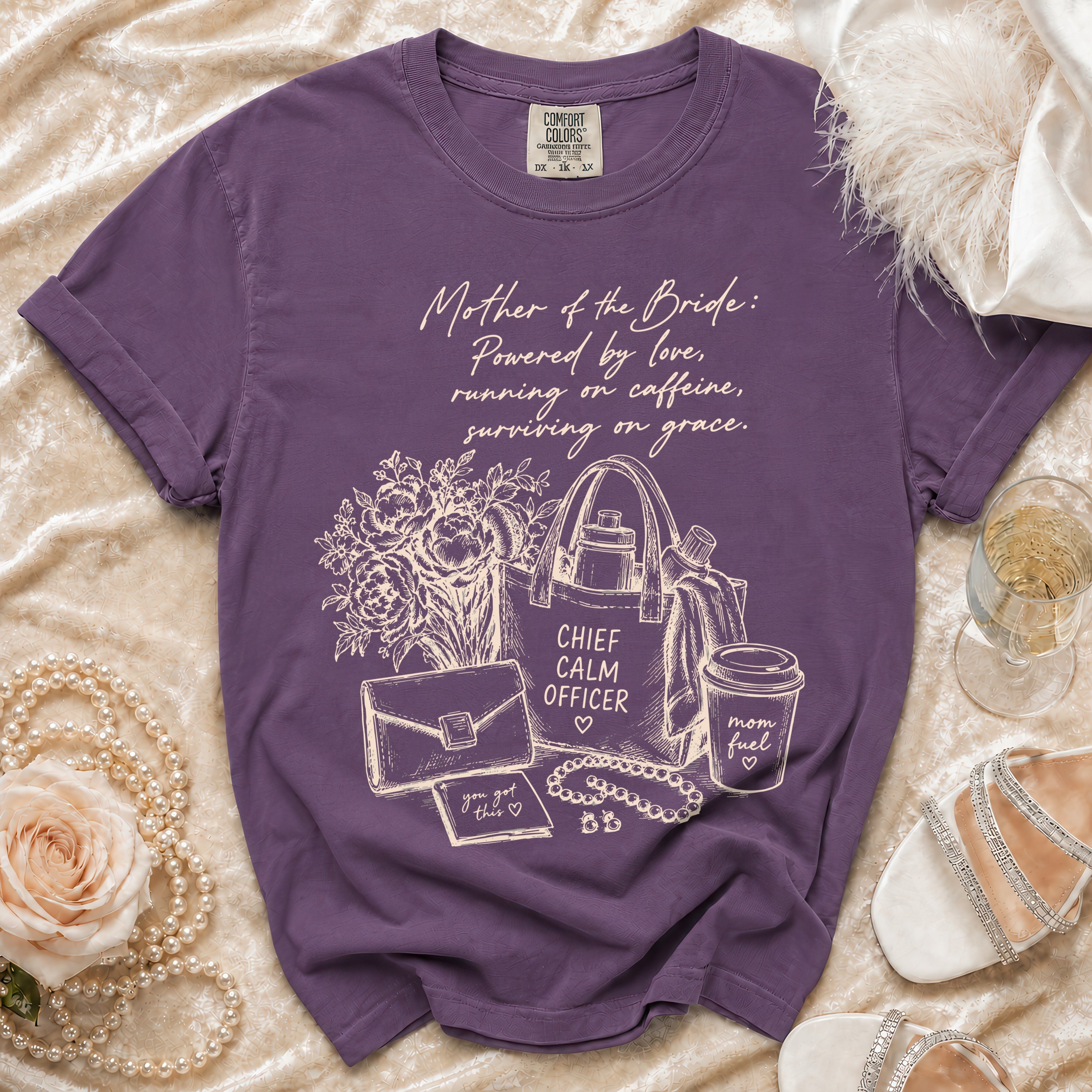 Purple t-shirt with "Mother of the Bride" graphic, tote bag, and coffee cup.