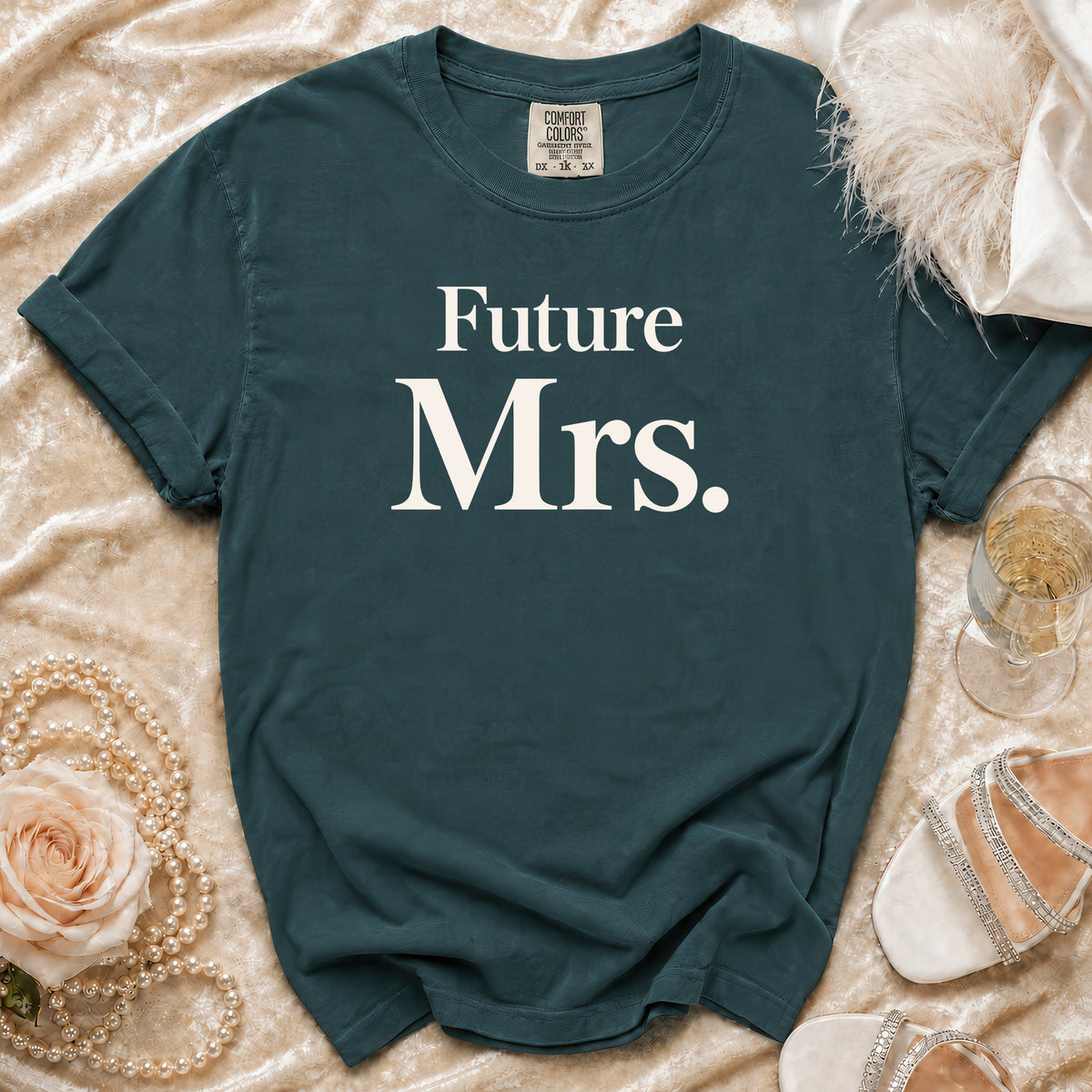 Teal t-shirt with "Future Mrs." printed in white, surrounded by bridal accessories.
