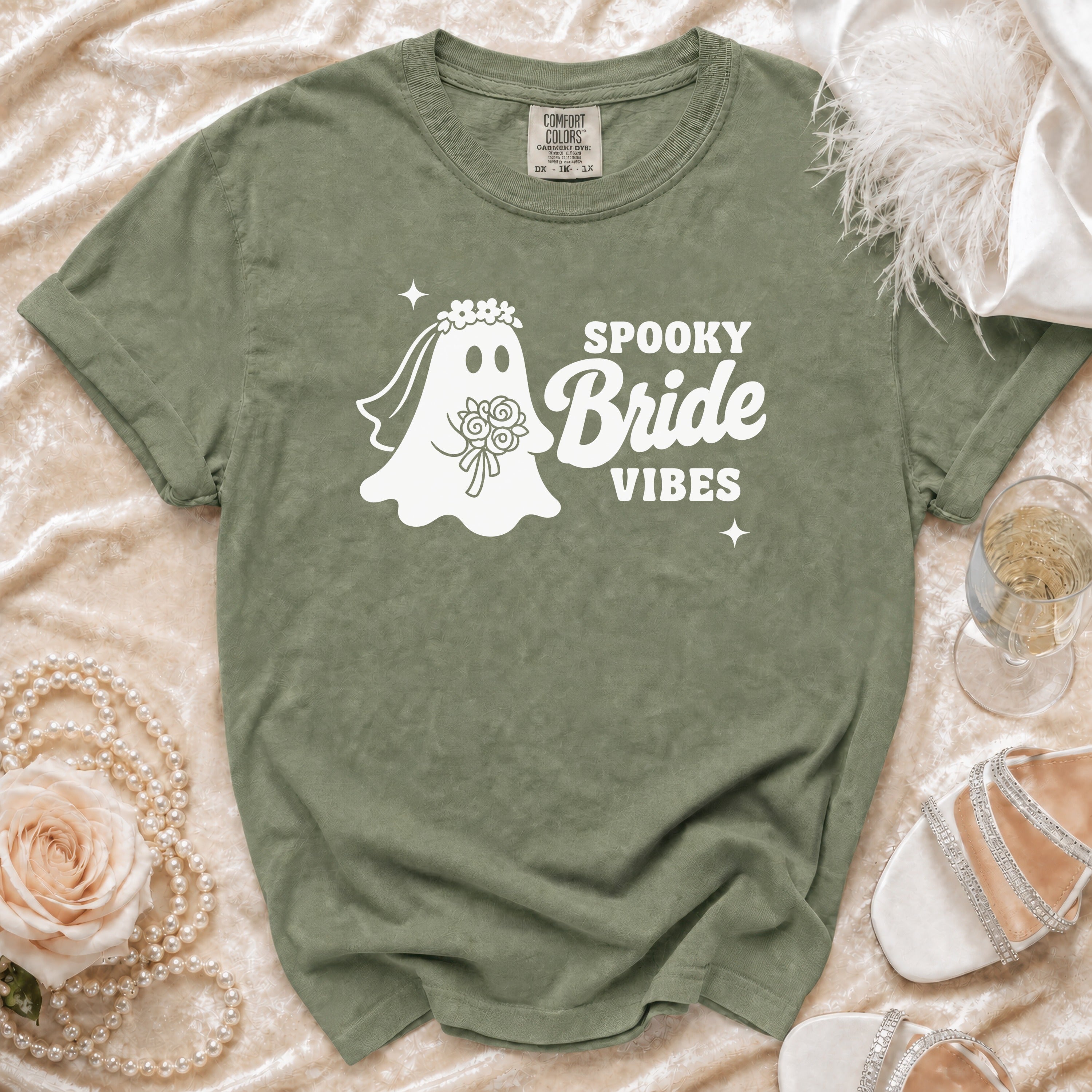 Olive green t-shirt with white "Spooky Bride Vibes" ghost graphic.