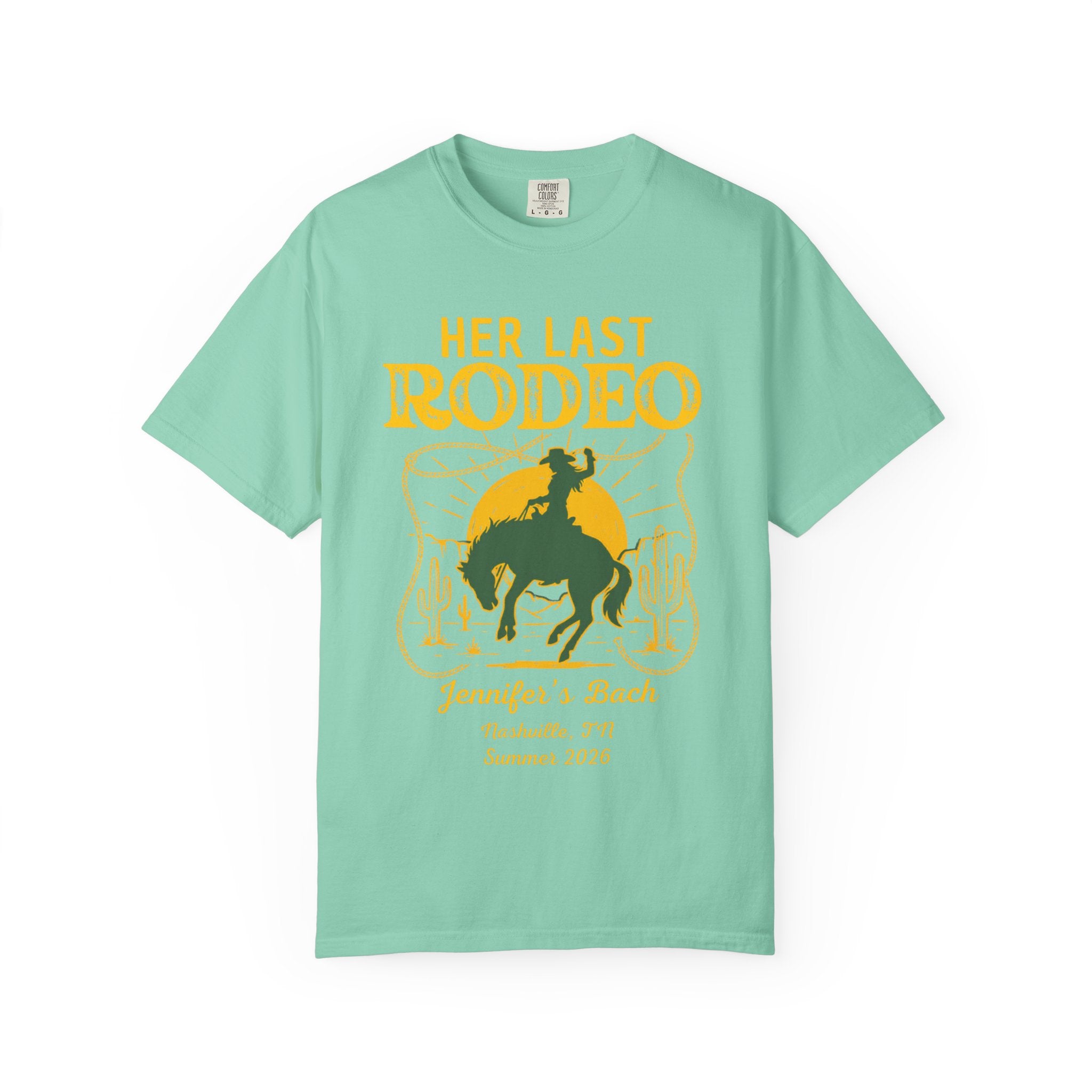 Her Last Rodeo text with cowboy and cactus design on teal t-shirt.