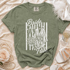 Olive green t-shirt with white "Bride Tribe" graphic featuring champagne glasses and a robe.