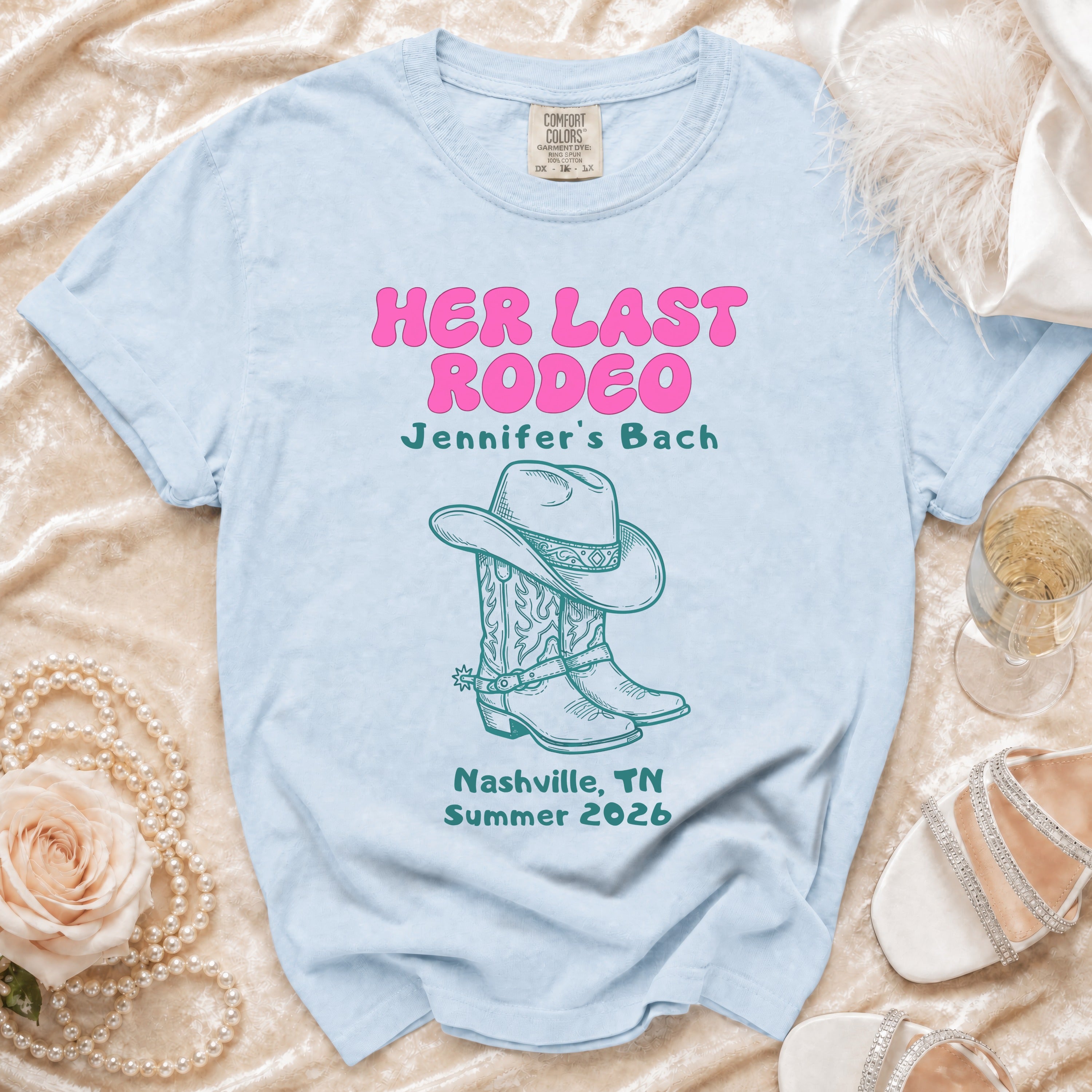 Light blue t-shirt with "Her Last Rodeo" and bachelorette details.