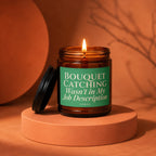 Amber jar candle with lit flame and green label reading "BOUQUET CATCHING Wasn't in My Job Description".