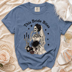 Blue t-shirt with skeleton bride graphic and text "This Bride Bites".