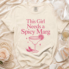 Cream t-shirt with "This Girl Needs a Spicy Marg" graphic.