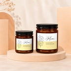 Two amber glass candles with "For My Other Mom" text and floral illustrations.