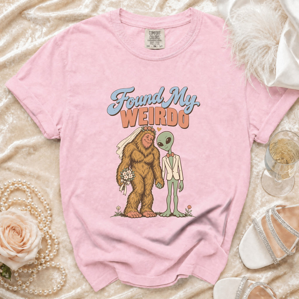Pink t-shirt with Bigfoot and alien wedding graphic and text "Found My WEIRDO".
