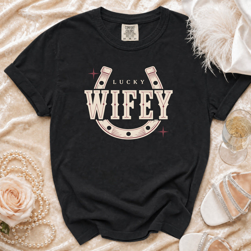 Black t-shirt with "LUCKY WIFEY" text and horseshoe graphic.