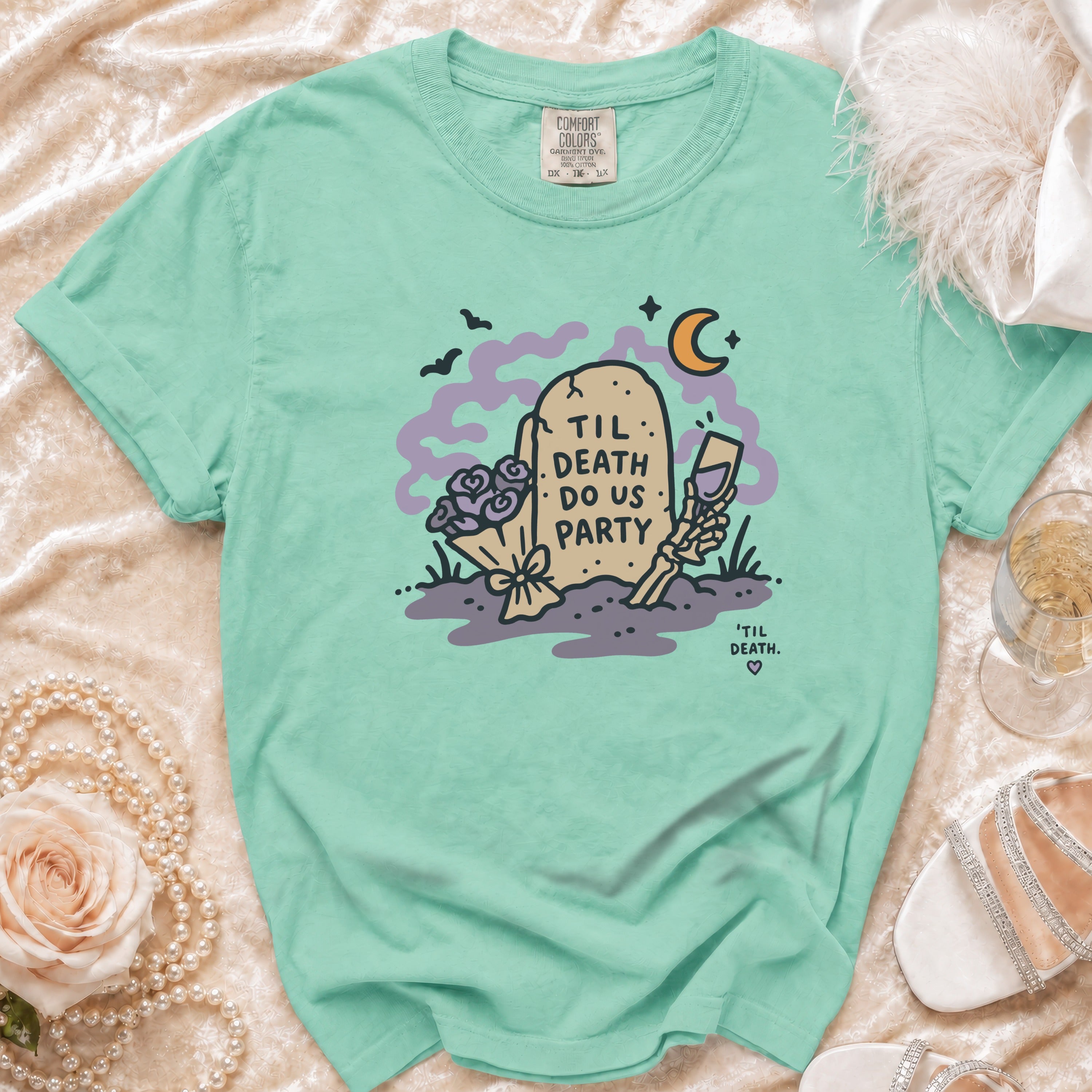Aqua t-shirt with "Til Death Do Us Party" tombstone graphic and skeleton hand.