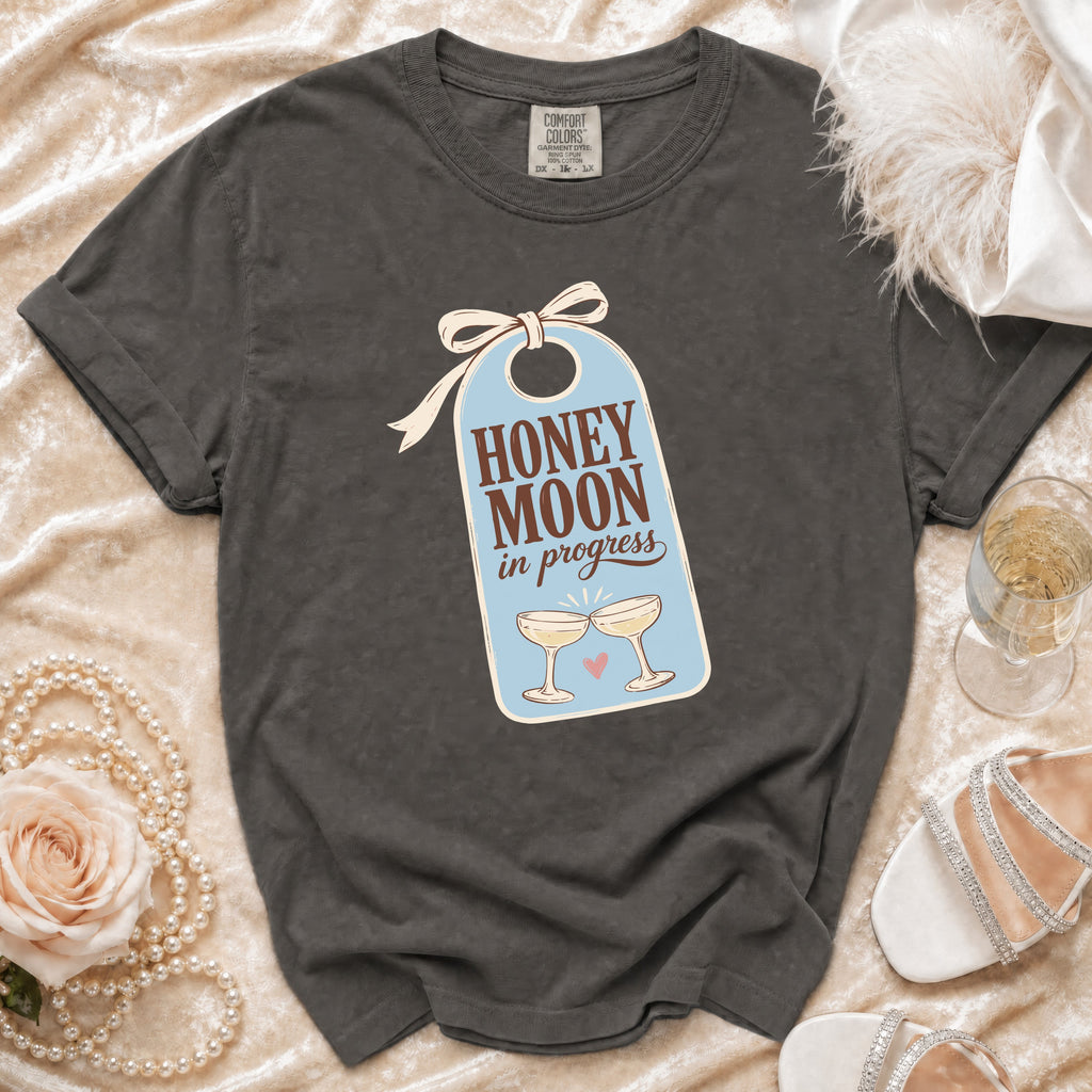 Dark gray t-shirt with "HONEY MOON in progress" graphic on a tag.