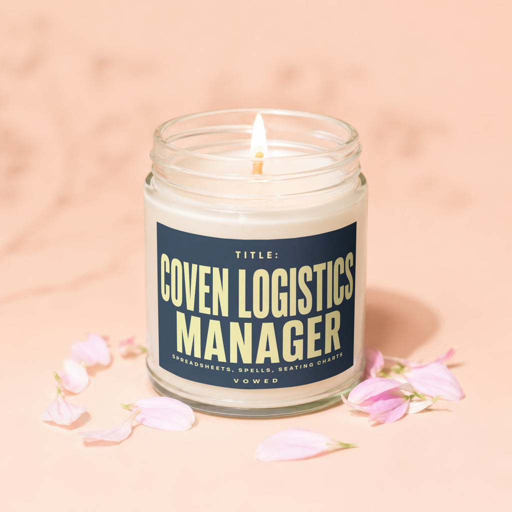 Candle labeled "Coven Logistics Manager" with text "Spreadsheets, Spells, Seating Charts" and "Vowed".