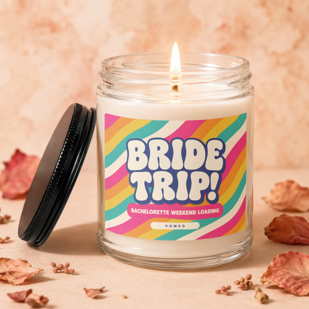 Candle with "Bride Trip!" and "Bachelorette Weekend Loading" text on colorful label.