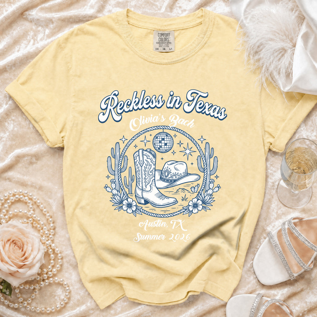 Yellow t-shirt with "Reckless in Texas, Olivia's Bach, Austin, TX, Summer 2026" text and western graphics.