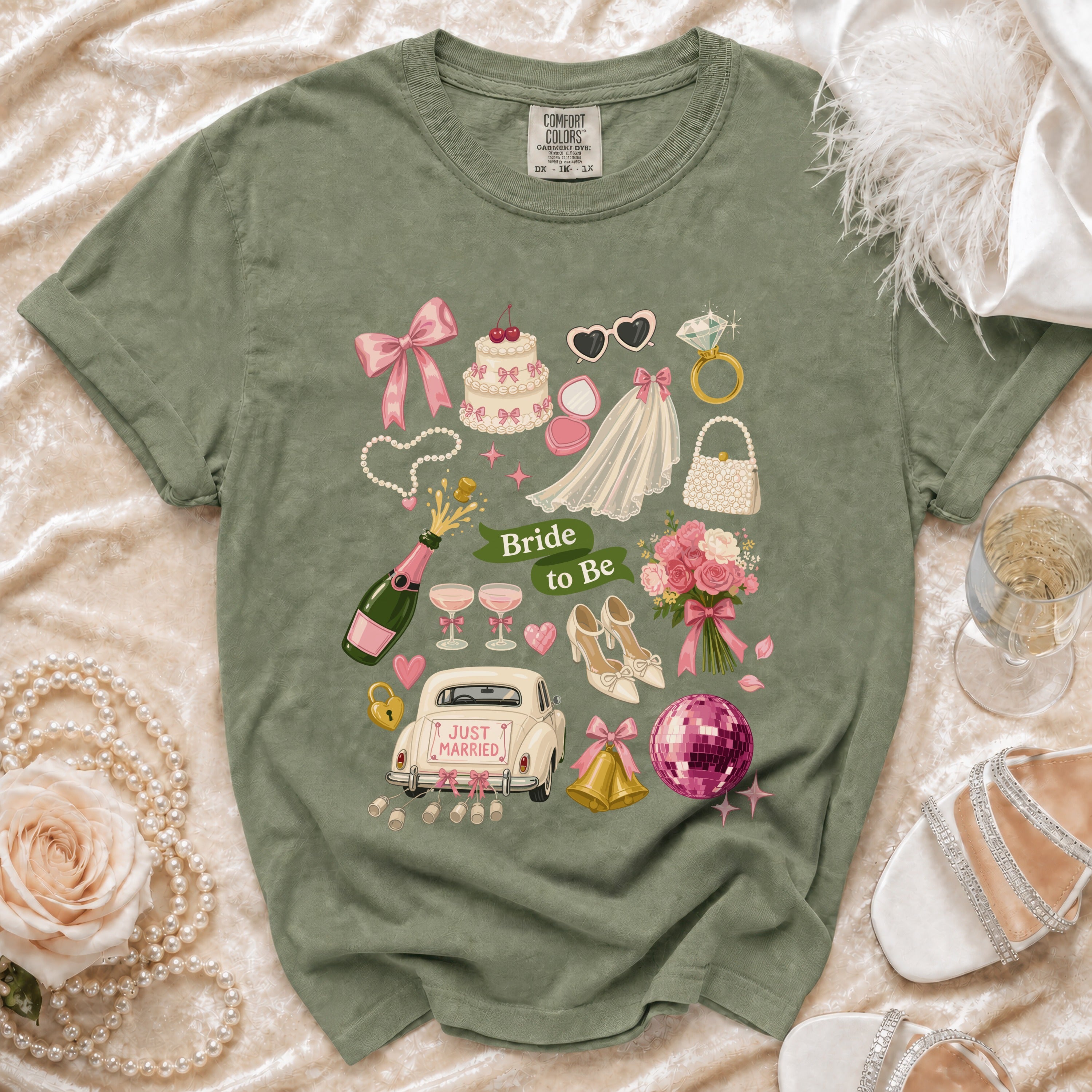 Green t-shirt with "Bride to Be" text and wedding icons like a cake, car, and veil.