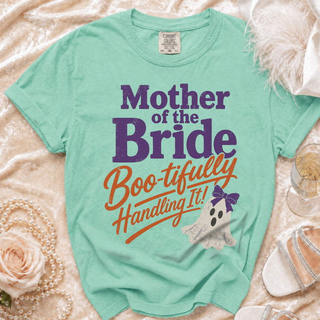 Seafoam green t-shirt with "Mother of the Bride Boo-tifully Handling It!" text and ghost graphic.