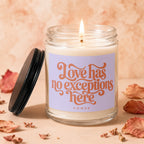 Glass jar candle with lit wick and "Love has no exceptions here" text.