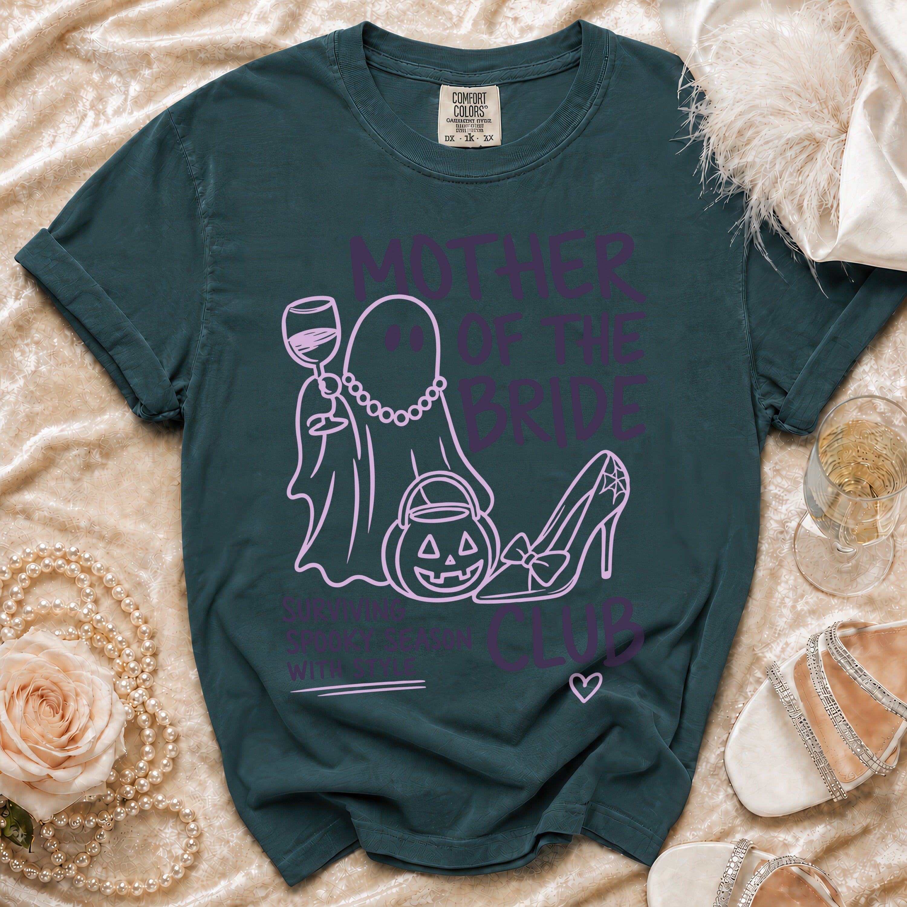 Dark teal t-shirt with "Mother of the Bride" text, ghost, and Halloween graphics.