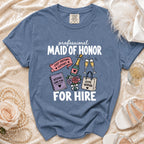 Blue Comfort Colors t-shirt with "Professional Maid of Honor For Hire" graphic.
