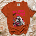 Orange t-shirt features skeleton bride graphic with "This Bride Needs a Martini" text.