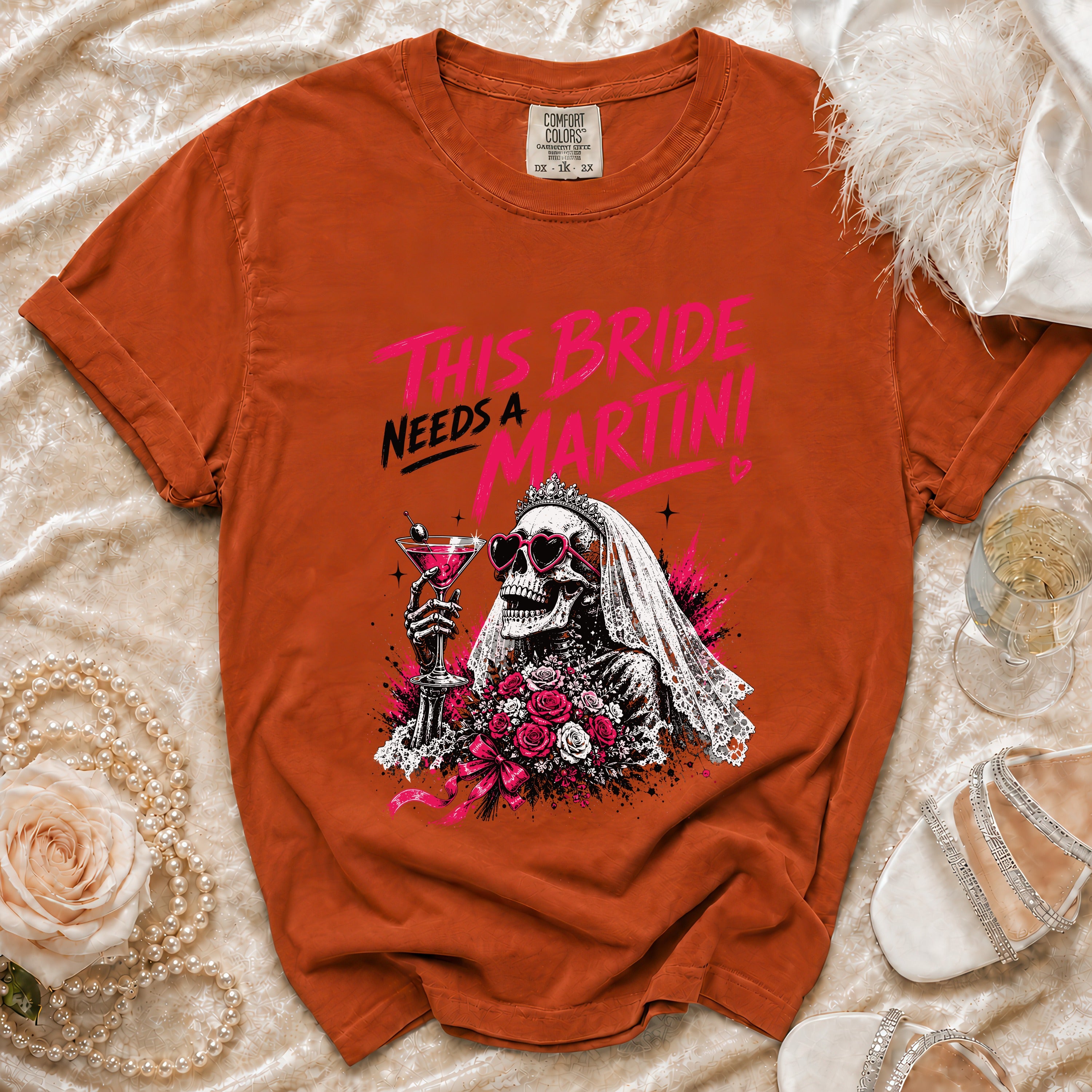 Orange t-shirt features skeleton bride graphic with "This Bride Needs a Martini" text.