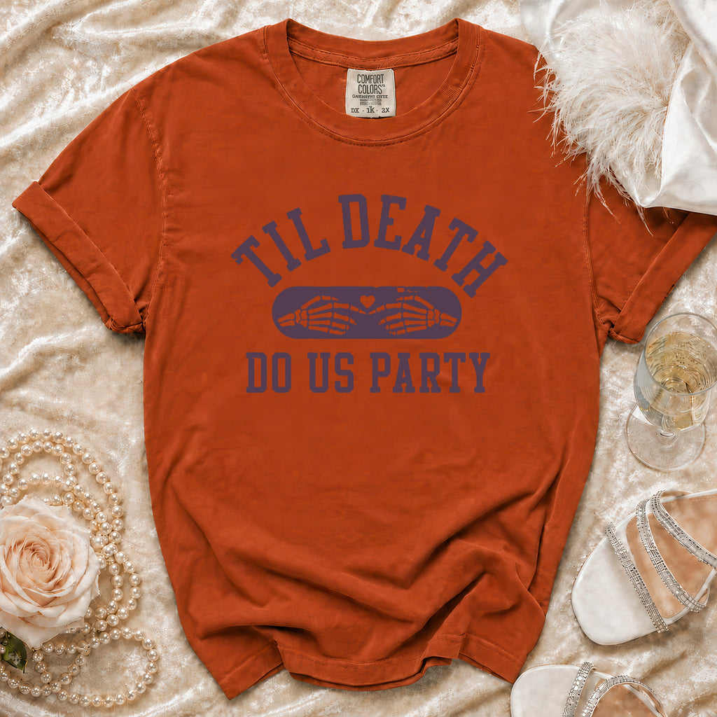 Orange t-shirt with "Til Death Do Us Party" text and skeleton hands graphic.