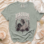 Bride After Dark t-shirt with skeleton bride holding bouquet, framed by roses and candles.