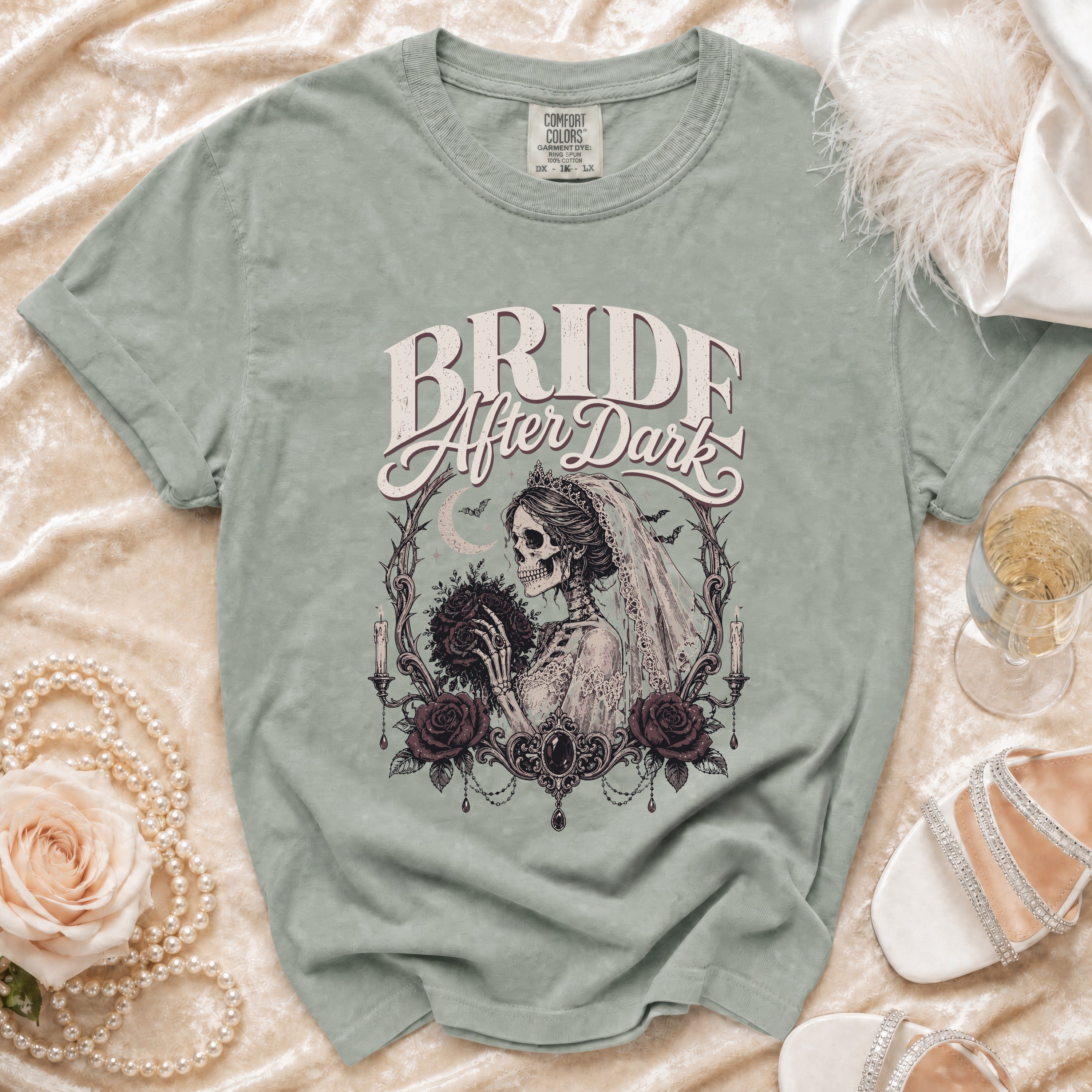 Bride After Dark t-shirt with skeleton bride holding bouquet, framed by roses and candles.