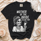 Black t-shirt with "Mother of the Bride to Die For" text and skeleton graphic.