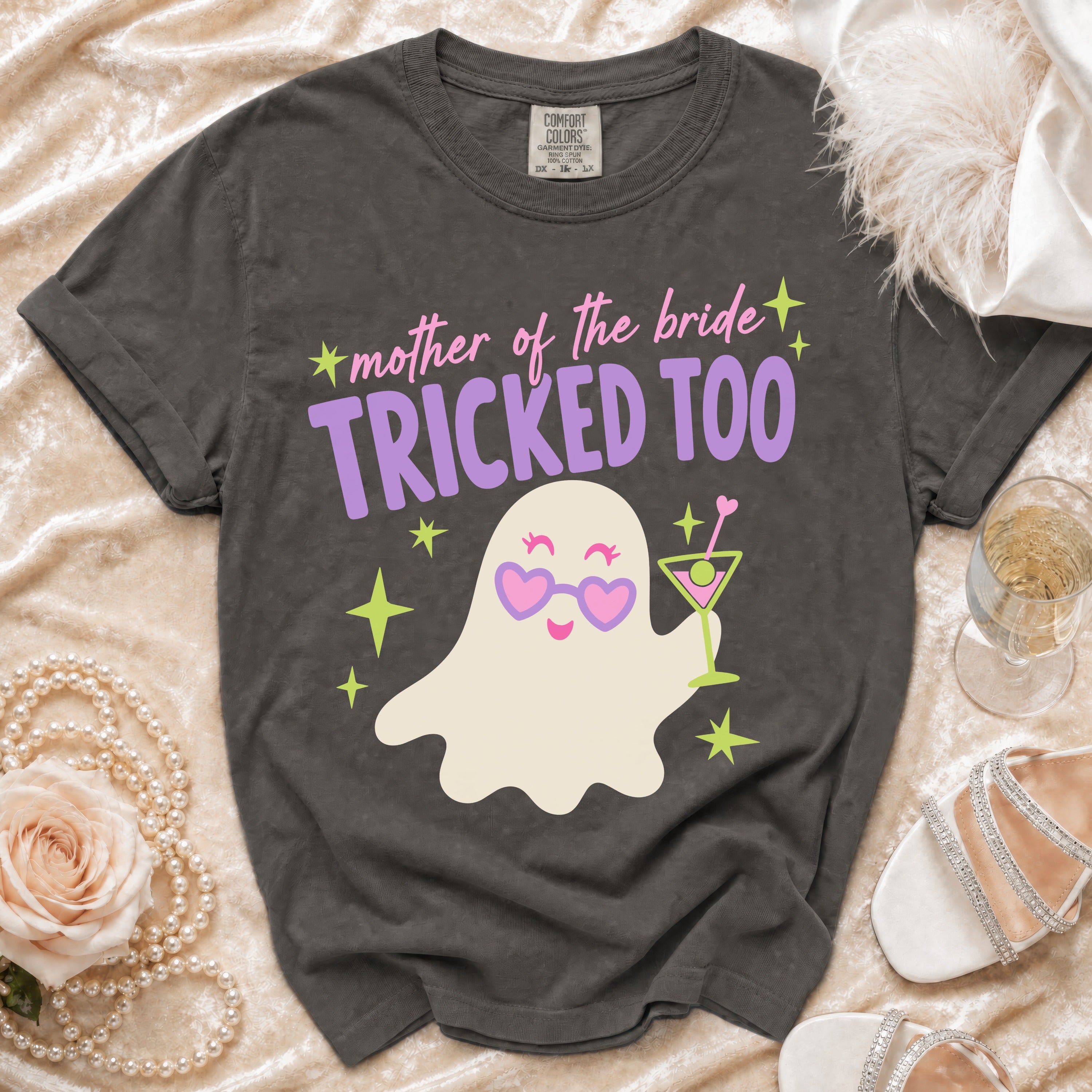 Dark grey t-shirt with "mother of the bride+ TRICKED TOO" text and ghost graphic.